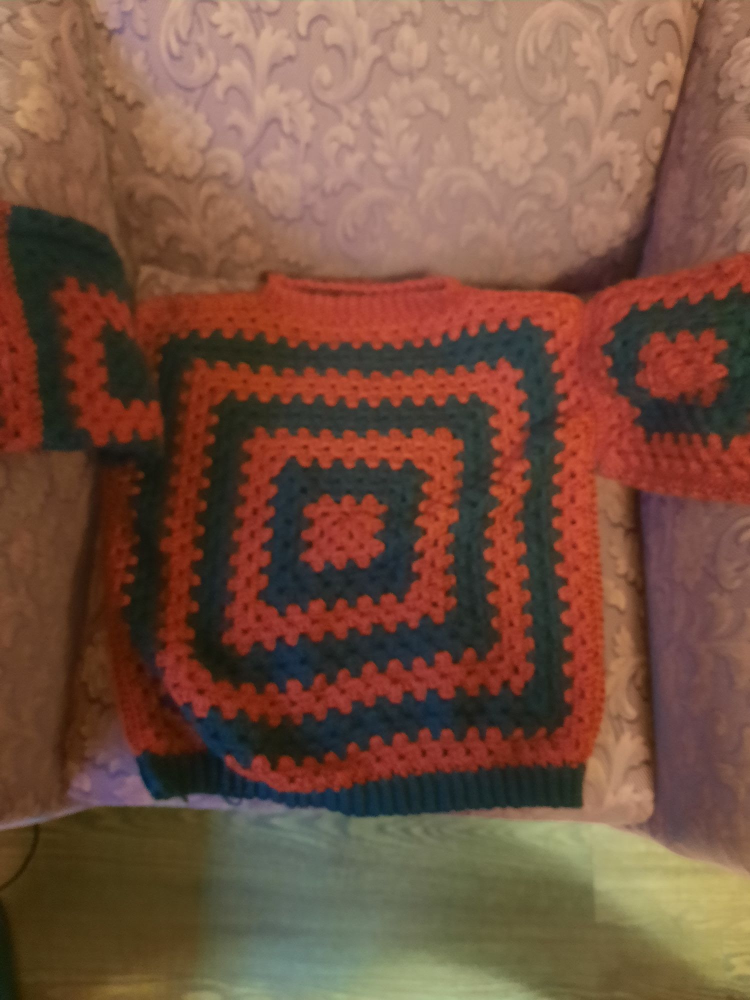 Red and black crochet granny square sweater