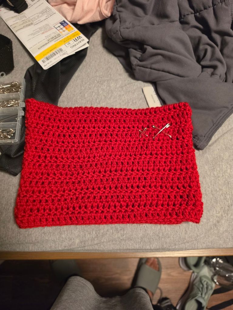 Red, crochet cat beanie with safety pins